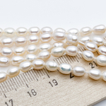 Жемчуг, размер около 6*4,5 мм, цена за 30-31 шт (1/2 нити)