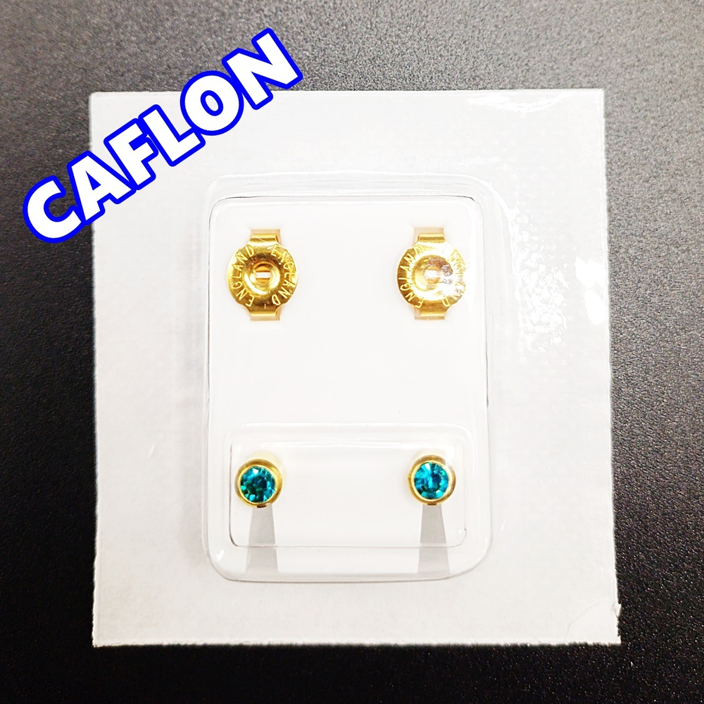 Серьги-гвоздики для прокола ушей под пистолет. CAFLON (Англия). Золотистые с бирюзовыми ( Декабрь) кристаллами