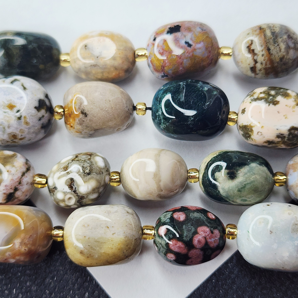 Океаническая яшма, риолит, крупная галтовка, 12-15 мм, овалы, цена за нить 12.5 - 13 см (1/3 нити)