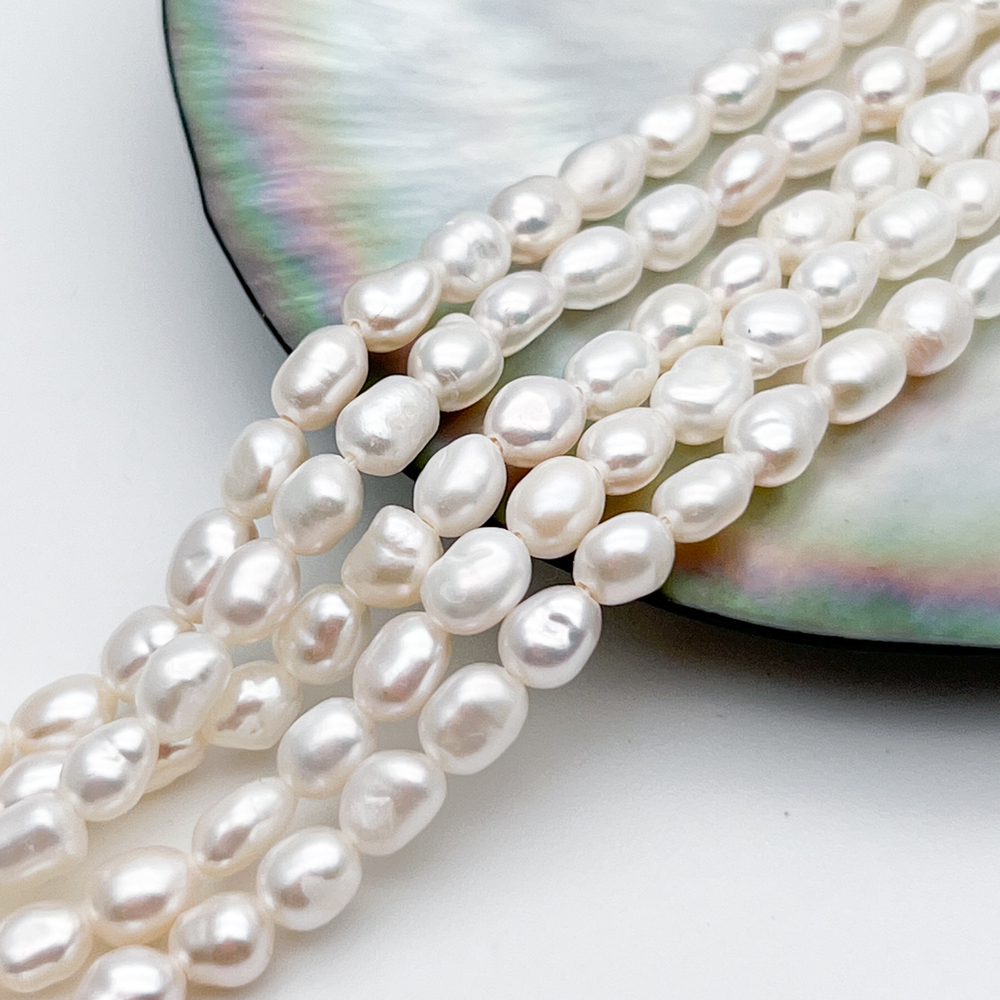 Жемчуг, размер около 6*4,5 мм, цена за отрезок 17 см (1/2 нити)