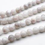 Агат "белый" бусины, диаметр около 6,6-6,8 мм, цена за 27-28 шт (1/2 нити)