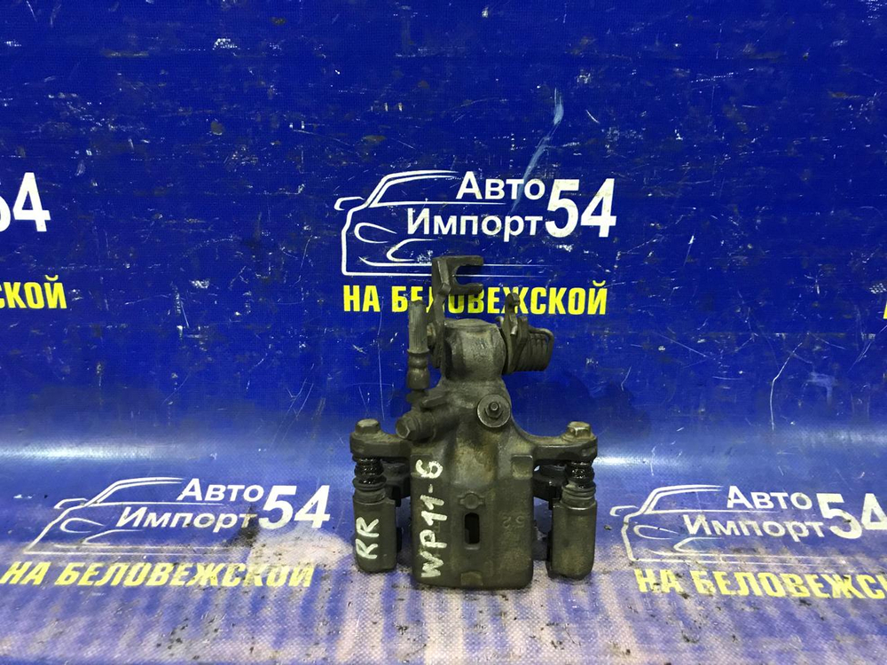 Суппорт тормозной задний правый NISSAN PRIMERA 1997