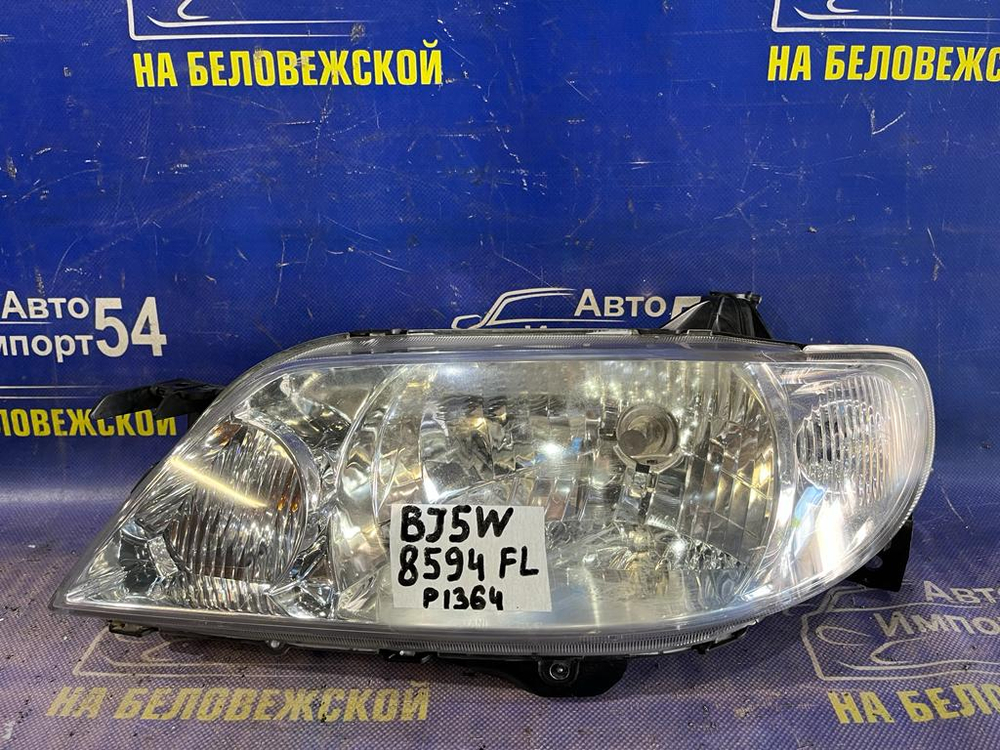 Фара передняя левая MAZDA FAMILIA 2000-2003