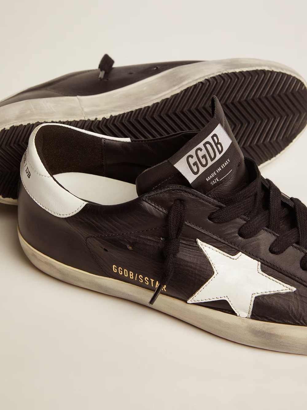 Super Star in black leather with white leather star and heel tab