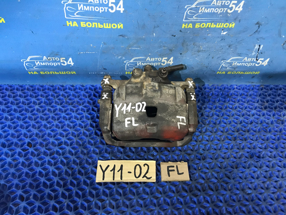 Суппорт тормозной передний левый NISSAN AD 1999