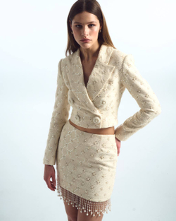 Костюм из твида с отделкой из пайеток и бисера