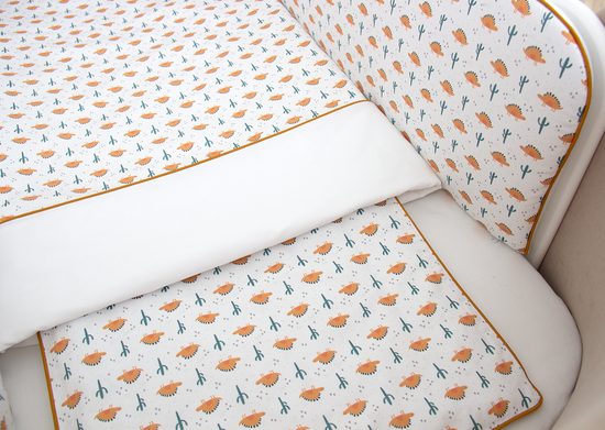 Мягкие бортики для кроватки KIDI soft "Жёлтые динозаврики" (кант, сатин)