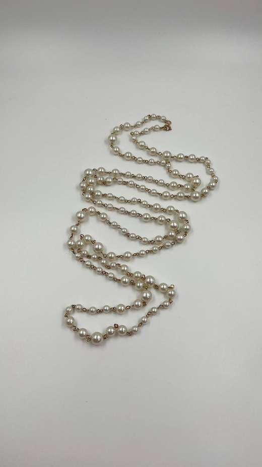 Длинная нить с жемчугом