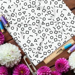 Ткань интерлок мелкие геометрические фигуры на бежевом фоне