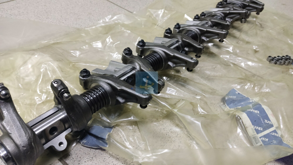 Ось с коромыслом и стойками в сборе 536.1007090