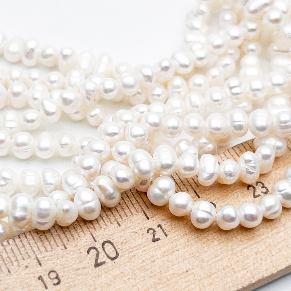 Жемчуг бусины, размер около 3,5-4*4,5-5,5 мм, цена за отрезок 17 см (1/2 нити)