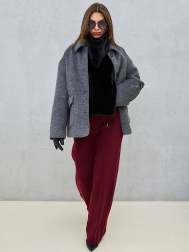 Черная манишка из эко-меха с завязками