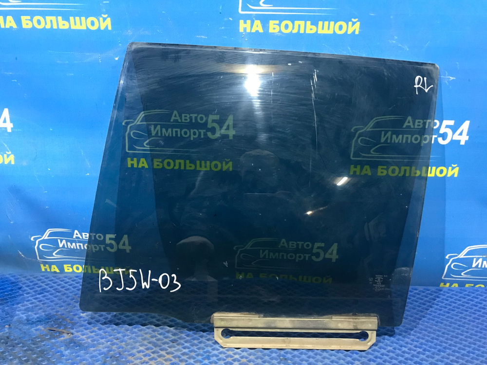 Стекло двери задней левой MAZDA FAMILIA 2001