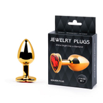 Золотистая анальная пробка с красным стразом-сердечком - 8 см. (Цвет: красный)