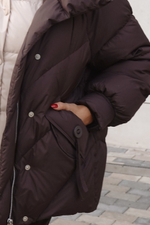 Пуховик средней длины с декором на карманах