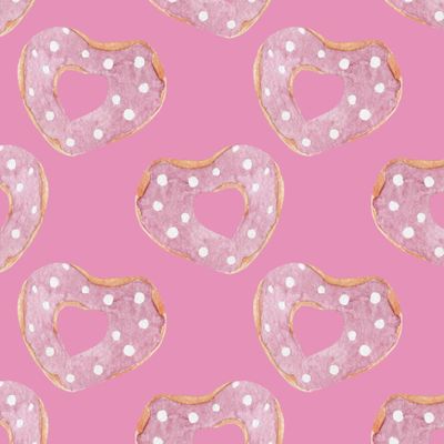 Пончики-сердечки на розовом фоне