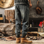 Джинсы мужские с резинками внизу брючина от бренда JIELEINUO