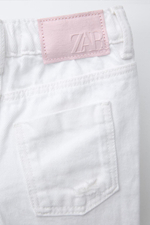 Джинсы mom fit с разрезами
