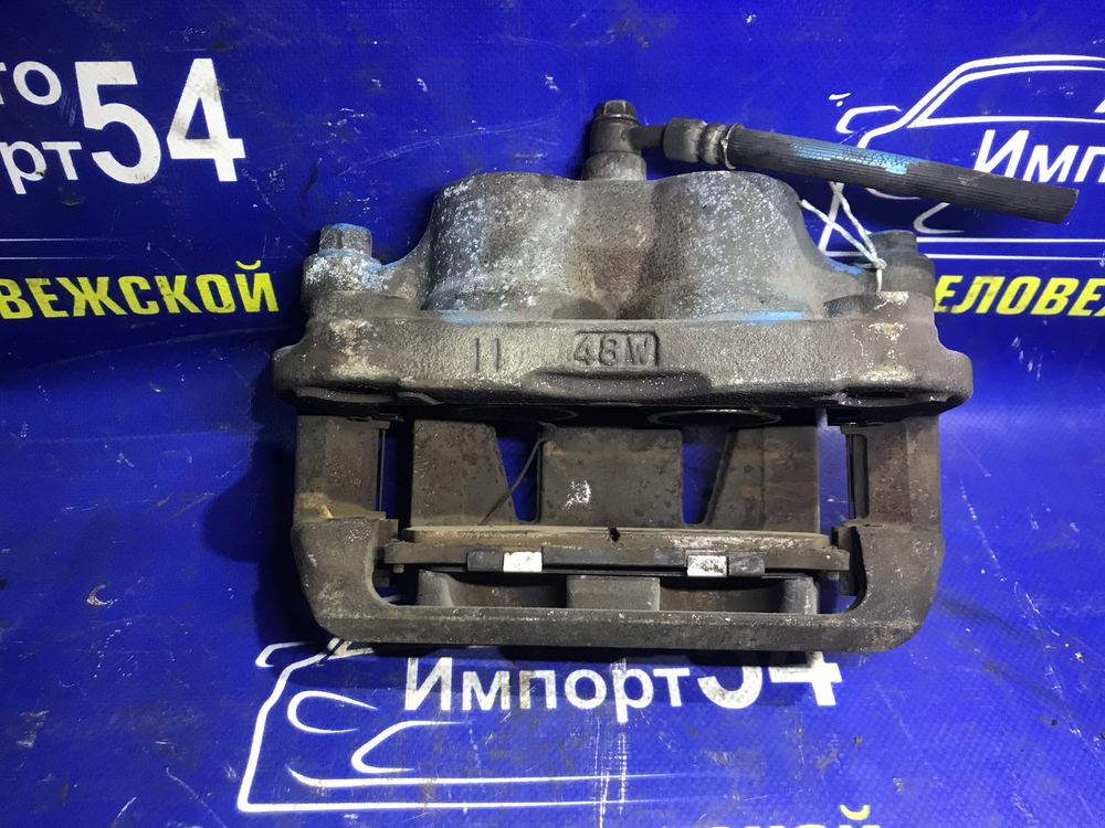 Суппорт тормозной передний левый NISSAN ELGRAND 2002-2010