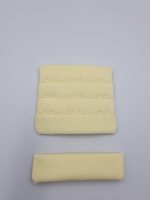 Застёжка тканевая на 3 крючка светло-желтая 57 мм (Pantone 11-0616 TPG)