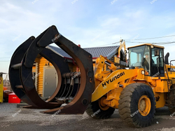 Бревно захват на Экскаватор-погрузчик New Holland