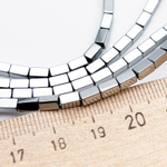 Гематит Брусок бусины (имитация), цвет серебристый, размер около 5*3 мм, цена за отрезок 19 см (1/2 нити)