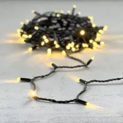 Светодиодная гирлянда с колпачком 100 теплых белых LED ламп 10 м., 24В., черный провод ПВХ, IP65, LTC (PST100CAP-11-1WW)