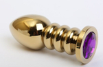 Золотистая фигурная анальная пробка с фиолетовым стразом - 10,3 см. (Цвет: фиолетовый)
