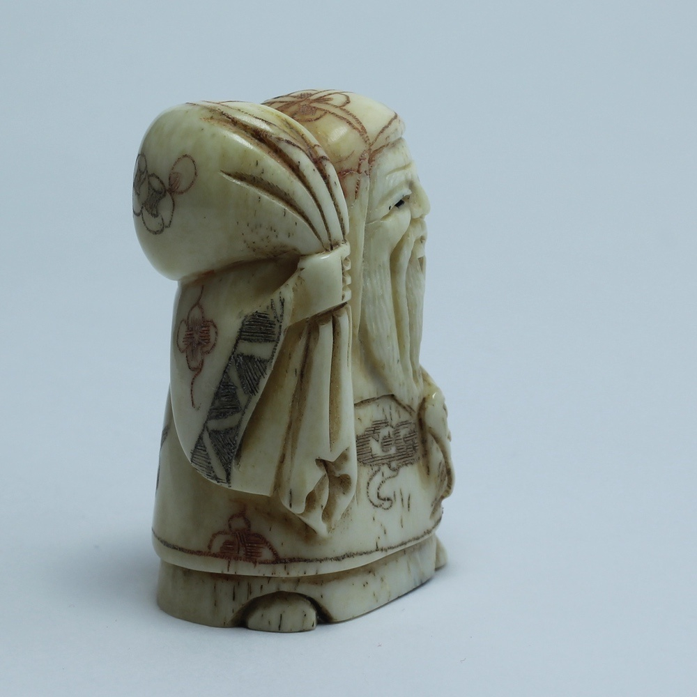 Нэцкэ Фукурокудзю с мешком риса и веером