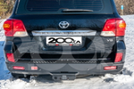 Бампер задний силовой РИФ для Toyota Land Cruiser 200 (2007-2012) стандарт с квадратом под фаркоп и фонарями.