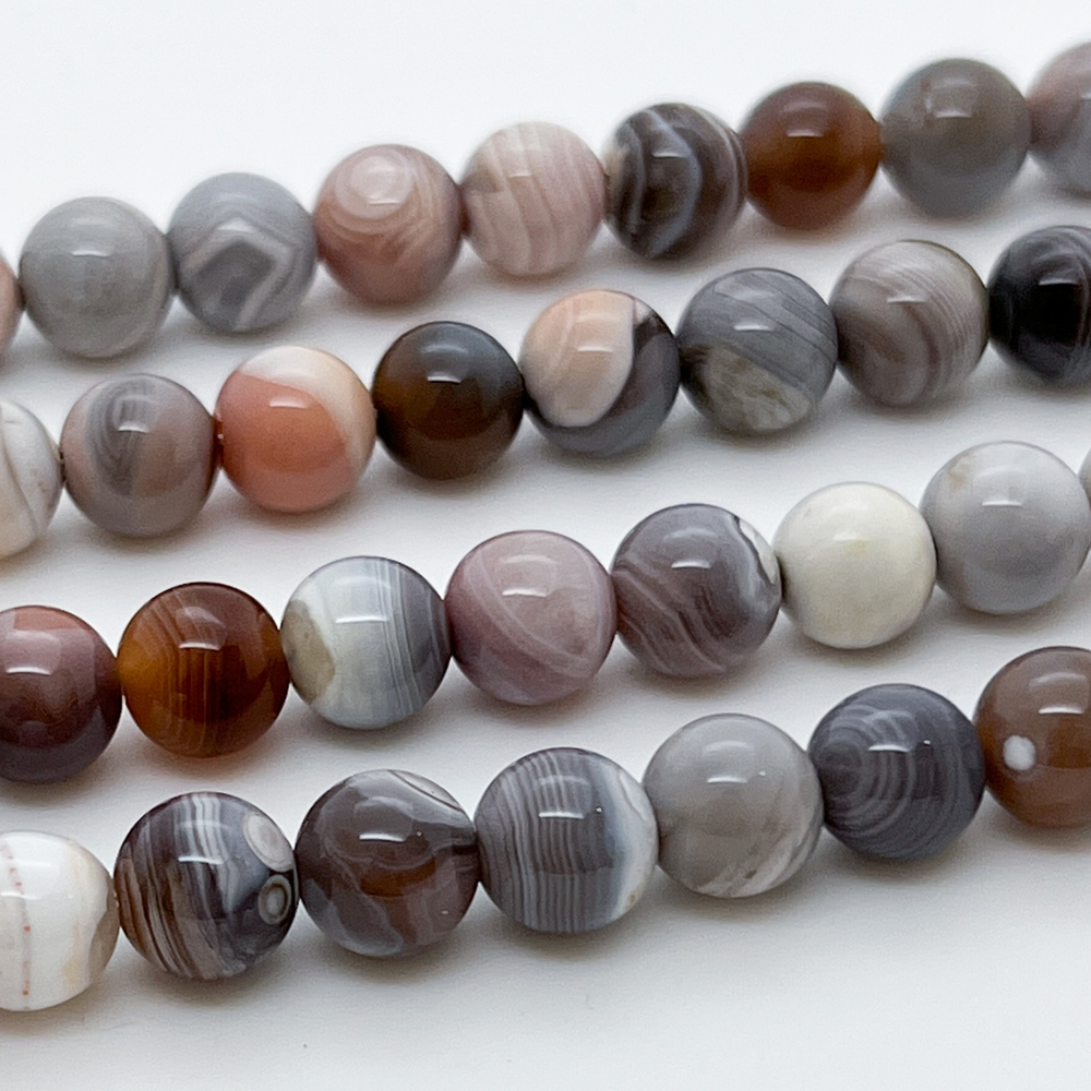 Агат Ботсвана, розовый тон, диаметр 7,9-8,1 мм, цена за 22-23 шт (1/2 нити)