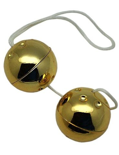 Золотистые шарики со смещённым центром тяжести