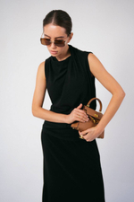 Костюм из тонкого трикотажа с юбкой в макси длине и дизайнерским топом