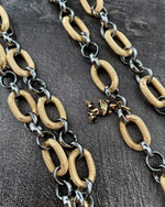 Цепь-трансформер длинная: графитовые кольца ролло и овальные золотые рифленые, с монетой