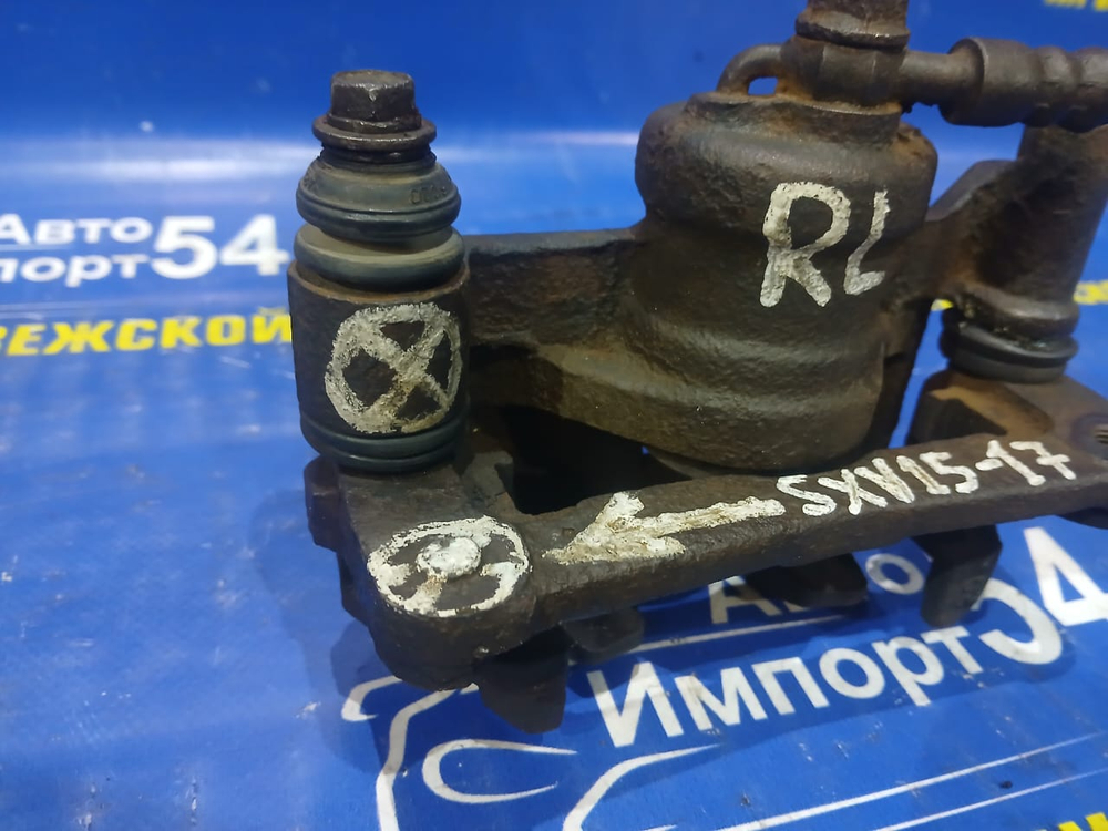 Суппорт тормозной задний левый TOYOTA SCEPTER 1994