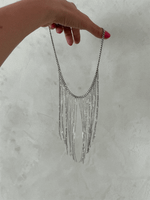 Колье с тонкими цепочками, оттенок серебро. Выполнено из стали. Регулировка длины.