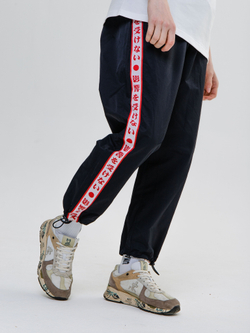 Брюки UNAFFECTED Япония с лампасами Черный