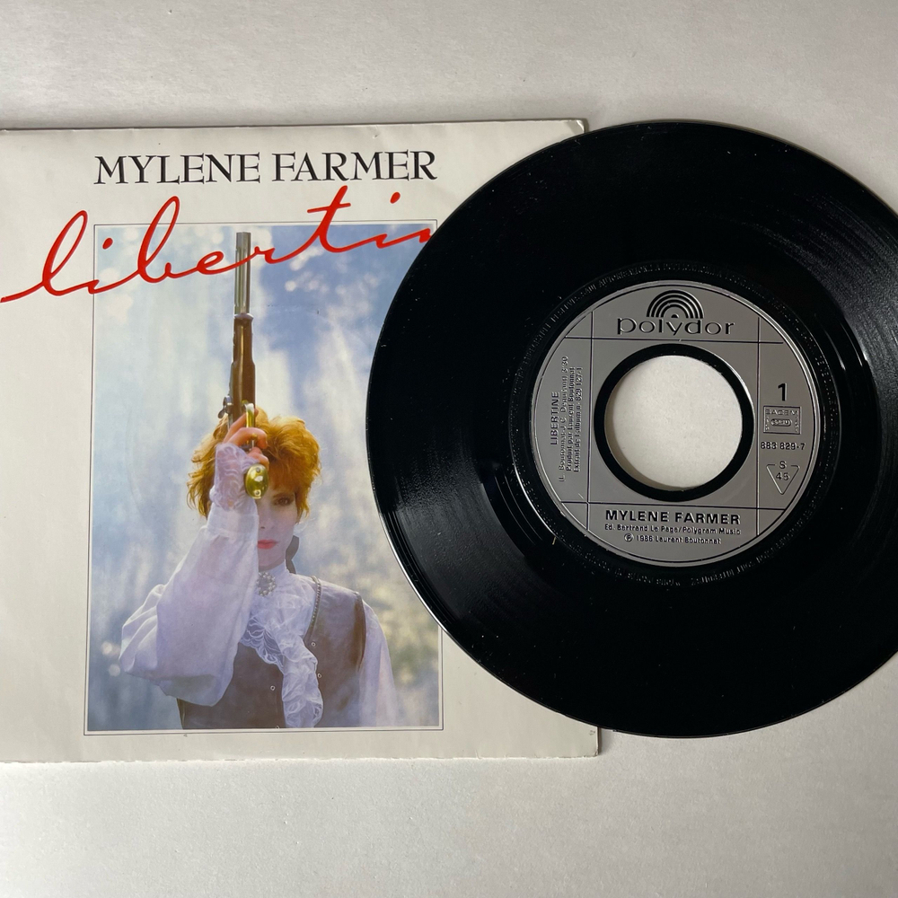Винтажная виниловая пластинка 7 дюймов (маленькая пластинка) Mylene Farmer Libertine (Франция 1986)