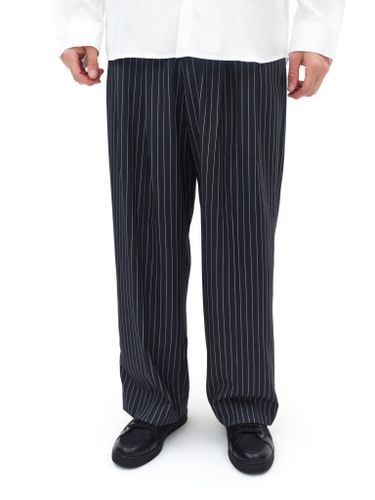 Черные брюки в полоску Fleur с защипами