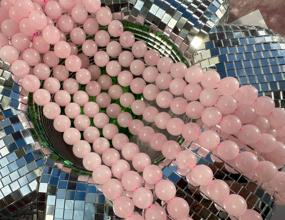 Нить бусин из розового кварца 10,4мм, гладкие