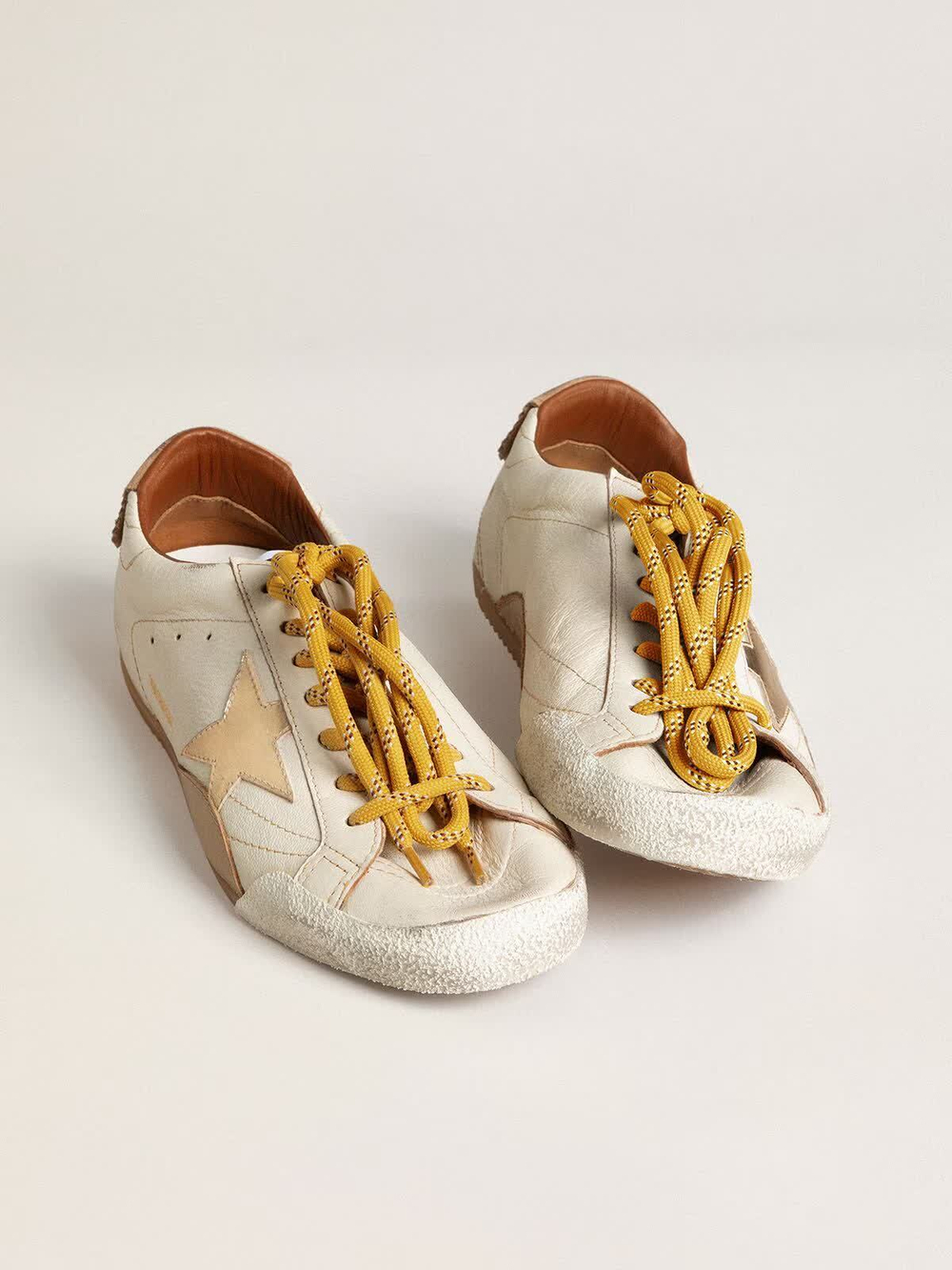 True Star in white nappa leather with gold star and beige suede heel tab