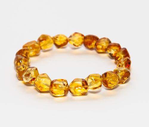 Браслет из цельного натурального янтаря, бусины 10-11 мм "кусанка"