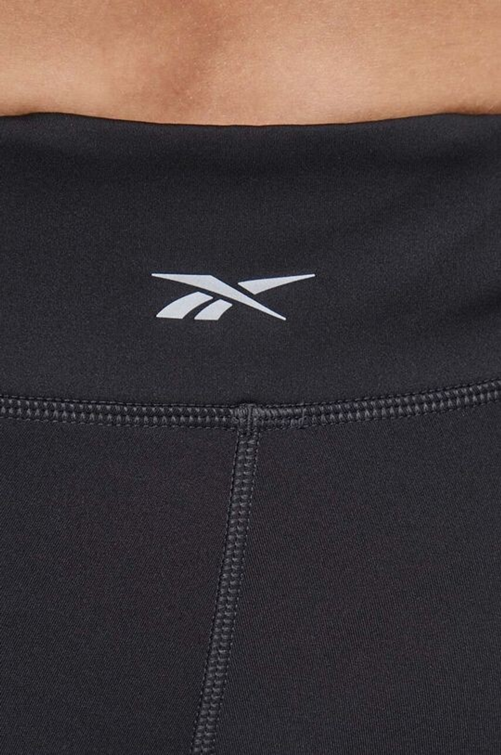100034899 Тайтсы REEBOK женские