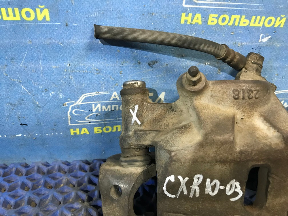 Суппорт тормозной передний левый TOYOTA ESTIMA 1998