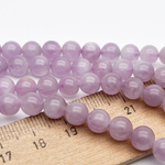 Кунцит бусины, диаметр около 6,6-6,8 мм, цена за 14-15 шт (1/4 нити)