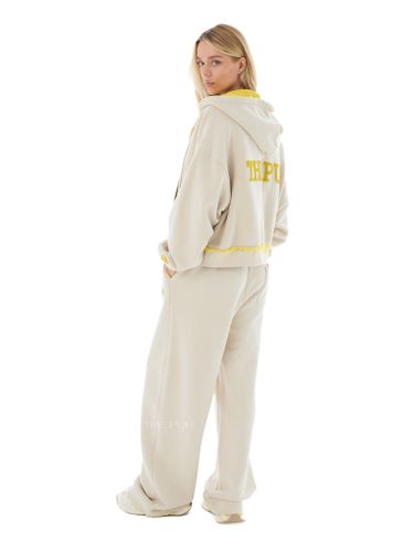 Бежево-желтый спортивный костюм с лого