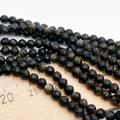 Обсидиан "Золотой" граненый бусины, диаметр около 3,8 мм, цена за отрезок 19 см (1/2 нити)