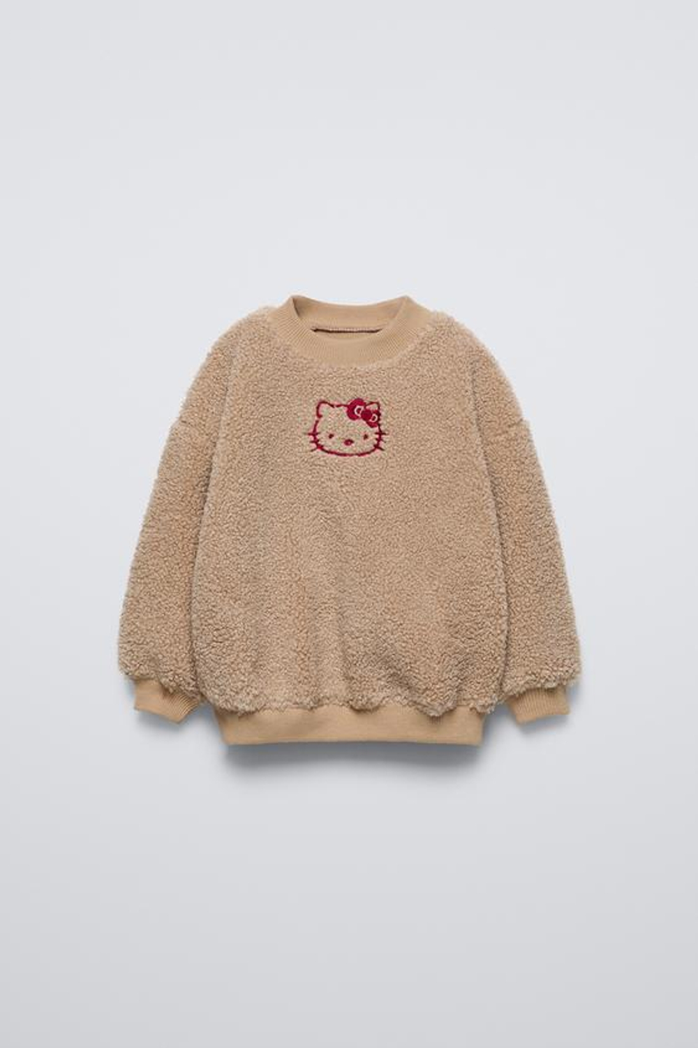 ZARA ТОЛСТОВКА ИЗ ИСКУССТВЕННОЙ ОВЧИНЫ С ПОДКЛАДКОЙ HELLO KITTY ©, ТЕМНО-БЕЖЕВЫЙ