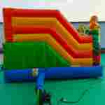 Коммерческий надувной батут «Весёлые динозаврики» с горкой, 5*4*2,8 м
