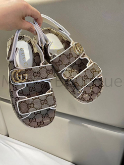 Женские сандалии Gucci GG коричневого цвета с узорами